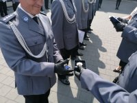 Zdjęcia przedstawiają umundurowanych policjantów i zaproszonych gości podczas Miejskich obchodów Święta Policji w Dąbrowie Górniczej.